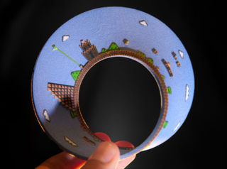 Illustration for article titled Super Mario Bros. Level 1 Recreated On A...Mobius Strip?